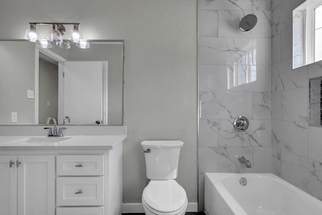 bathroom featuring a textured wall, toilet, vanity, and shower / tub combination