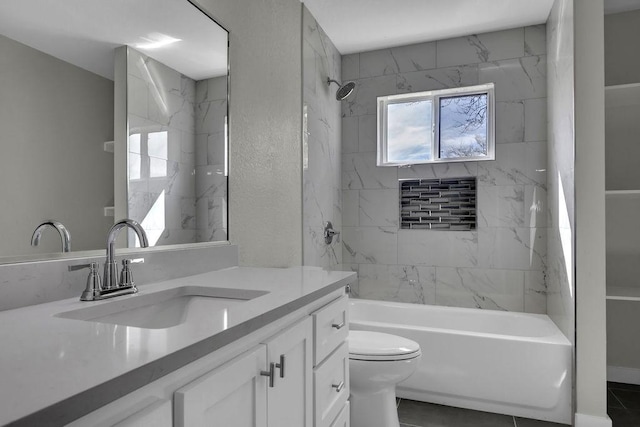 bathroom featuring toilet, a textured wall, vanity, and shower / bathing tub combination