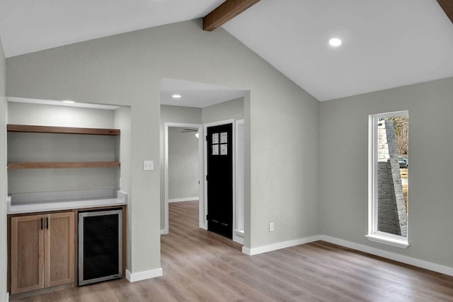 bar with lofted ceiling with beams, wine cooler, recessed lighting, baseboards, and light wood-style floors