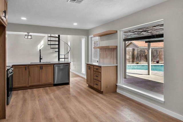 kitchen with stove, a sink, light countertops, dishwasher, and open shelves