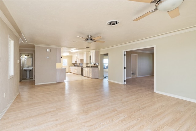 unfurnished living room with ceiling fan, light hardwood / wood-style floors, and crown molding