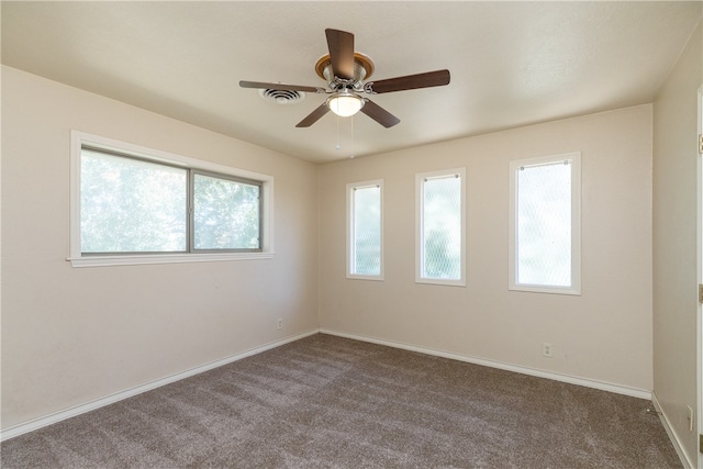 spare room with carpet and ceiling fan