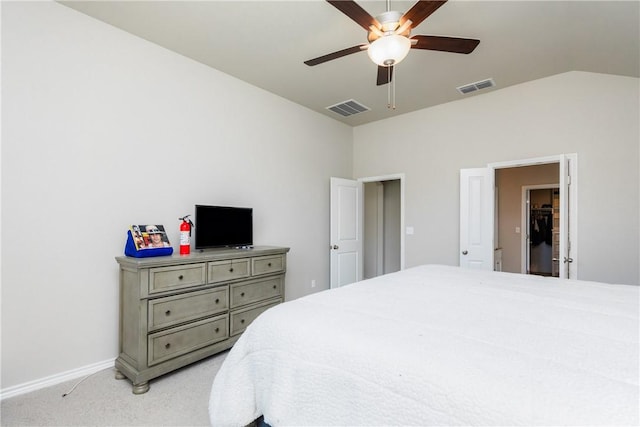 bedroom featuring visible vents, light carpet, baseboards, and vaulted ceiling