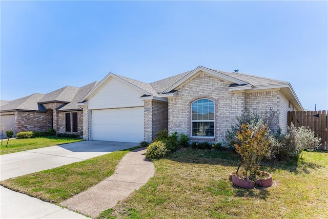 ranch-style home featuring brick siding, a front lawn, fence, a garage, and driveway