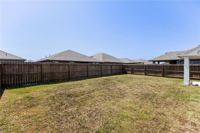 view of yard with a fenced backyard