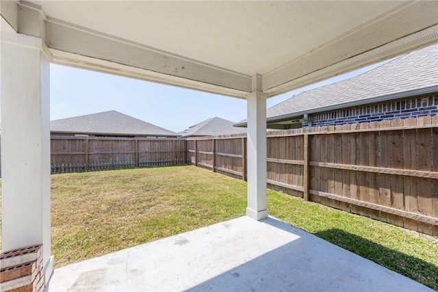 view of yard with a patio area and a fenced backyard