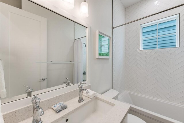 709 Sunrise Ave, Port Aransas, TX 78373 - full bath featuring toilet, vanity, and shower / bath combo