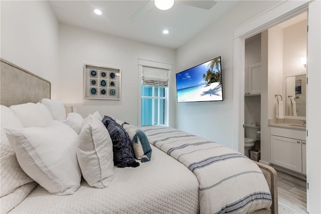 709 Sunrise Ave, Port Aransas, TX 78373 - bedroom featuring recessed lighting, light wood-type flooring, connected bathroom, and a ceiling fan