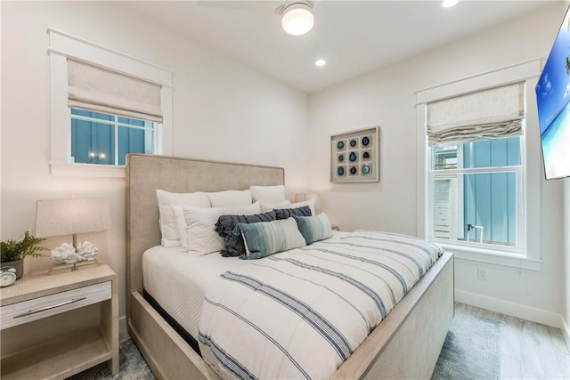 709 Sunrise Ave, Port Aransas, TX 78373 - bedroom featuring recessed lighting, multiple windows, baseboards, and wood finished floors