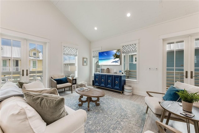 709 Sunrise Ave, Port Aransas, TX 78373 - living area featuring baseboards, high vaulted ceiling, recessed lighting, french doors, and light wood-type flooring