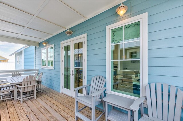 709 Sunrise Ave, Port Aransas, TX 78373 - wooden deck with outdoor dining area
