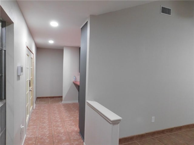 1408 Rose Dr, Alice, TX 78332 - hallway featuring recessed lighting, light tile patterned flooring, and baseboards