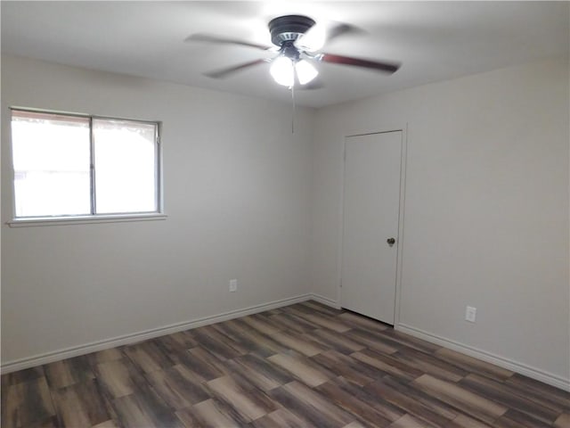 1408 Rose Dr, Alice, TX 78332 - spare room featuring ceiling fan, wood finished floors, and baseboards
