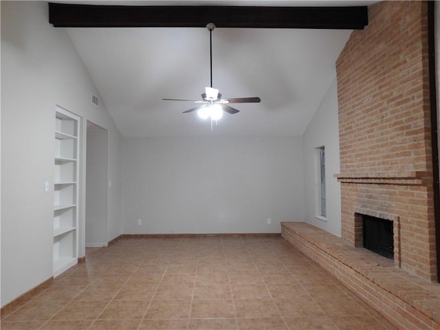 1408 Rose Dr, Alice, TX 78332 - unfurnished living room with ceiling fan, a fireplace, built in shelves, beamed ceiling, and baseboards