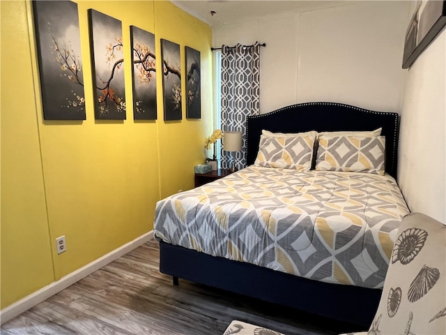 bedroom featuring hardwood / wood-style flooring