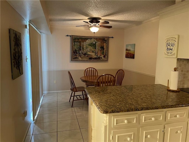 5218 Wooldridge Rd, Corpus Christi, TX 78413 - dining space featuring a ceiling fan, a textured ceiling, and light tile patterned floors