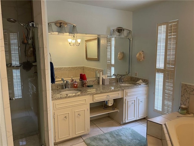 5218 Wooldridge Rd, Corpus Christi, TX 78413 - full bath featuring a stall shower, plenty of natural light, double vanity, and a garden tub