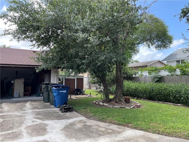 5218 Wooldridge Rd, Corpus Christi, TX 78413 - view of yard with an outbuilding and concrete driveway