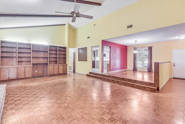 unfurnished living room with beam ceiling, parquet flooring, a textured ceiling, and ceiling fan