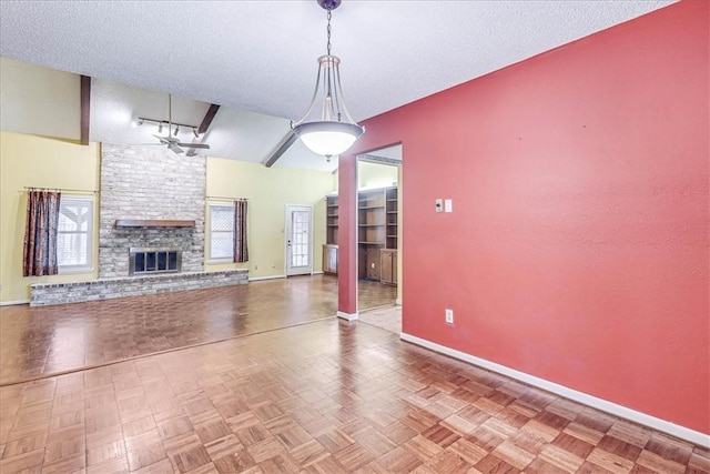 unfurnished living room featuring a stone fireplace, parquet floors, a textured ceiling, and ceiling fan