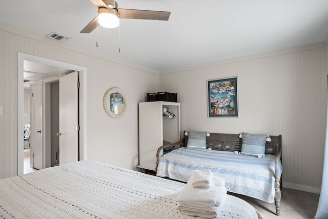 bedroom featuring ceiling fan and crown molding