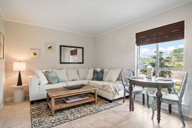 living room with ornamental molding and light tile patterned flooring