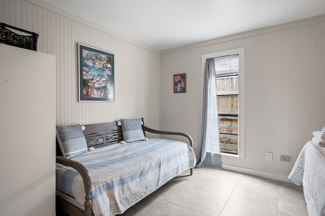 tiled bedroom with multiple windows