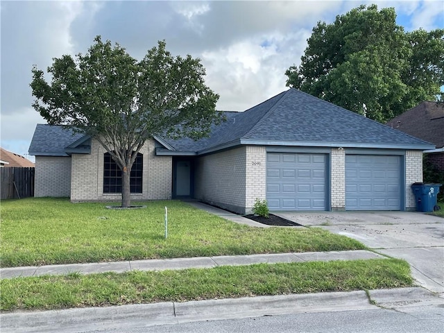 view of front facade with a garage and a front lawn