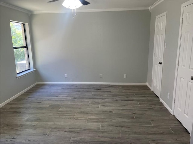 unfurnished room featuring ceiling fan and ornamental molding