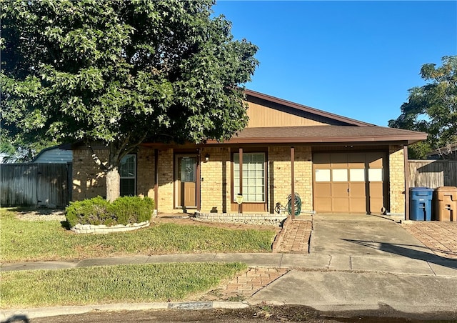 view of front of house with a garage and a front yard