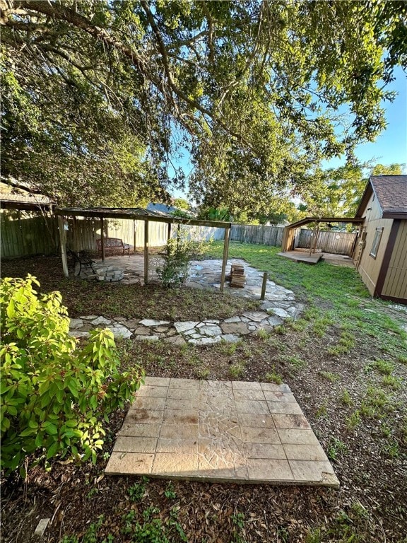 view of yard with a patio area and a shed