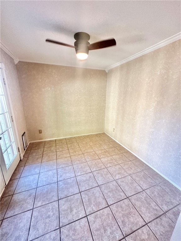 tiled spare room with ceiling fan and crown molding