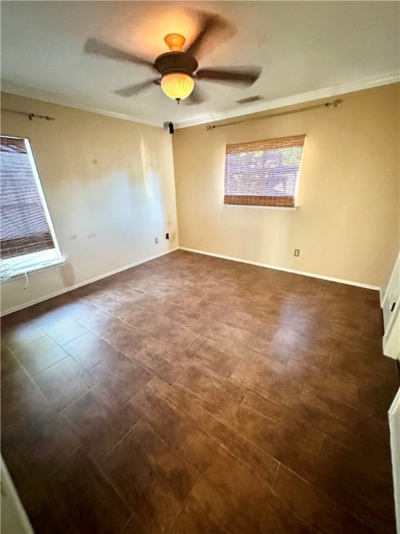 unfurnished room with ceiling fan and ornamental molding