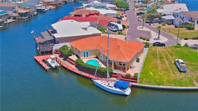 aerial view featuring a residential view and a water view