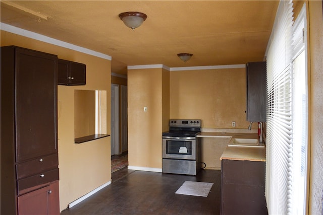 kitchen featuring dark brown cabinetry, sink, ornamental molding, stainless steel electric range oven, and dark hardwood / wood-style flooring