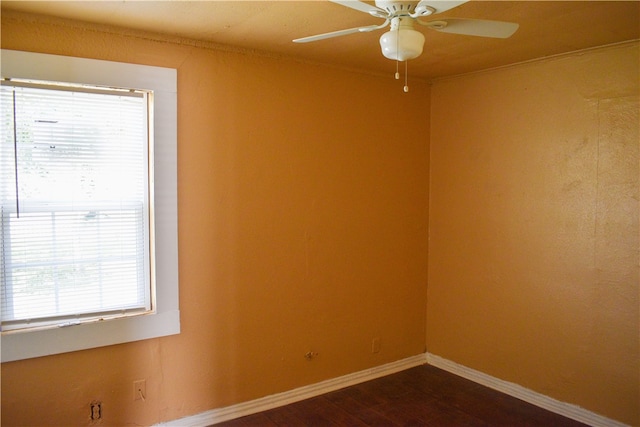 unfurnished room featuring dark hardwood / wood-style flooring and ceiling fan