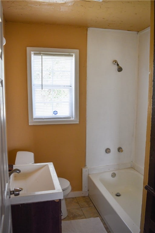 bathroom featuring vanity, tile patterned floors, and toilet