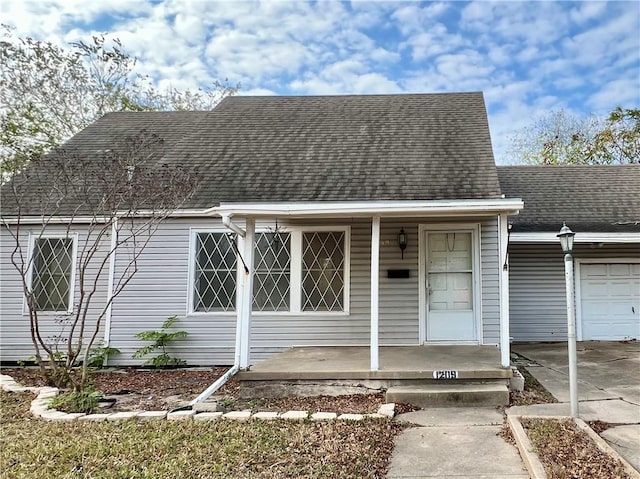 view of front of house with a porch and a garage