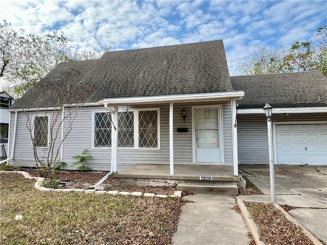 view of front facade featuring covered porch and a garage