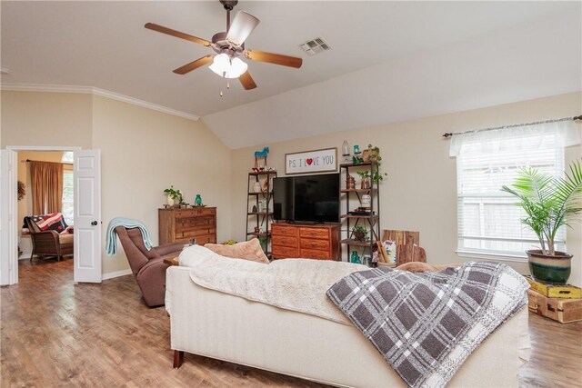 6005 Tapestry Dr, Corpus Christi, TX 78414 - living area featuring light wood-type flooring, ceiling fan, ornamental molding, vaulted ceiling, and baseboards