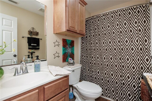 6005 Tapestry Dr, Corpus Christi, TX 78414 - full bathroom featuring toilet, vanity, and a shower with curtain