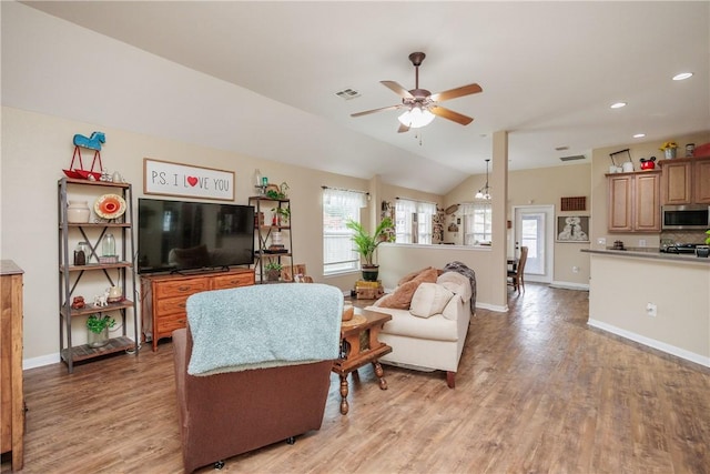 6005 Tapestry Dr, Corpus Christi, TX 78414 - living room with light wood finished floors, ceiling fan, vaulted ceiling, baseboards, and recessed lighting