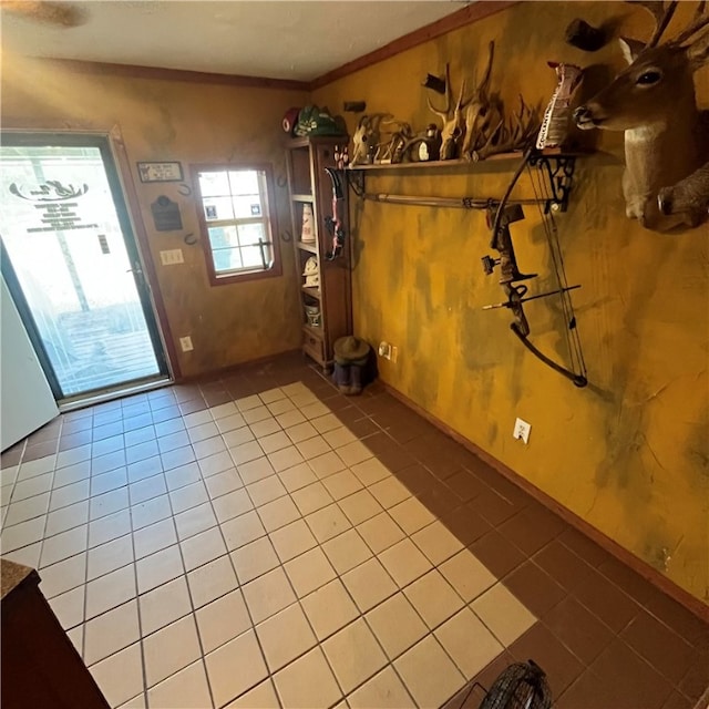 tiled entryway with crown molding