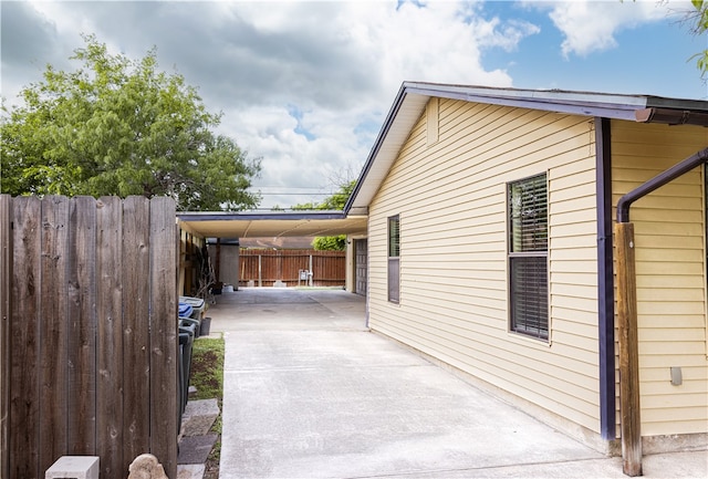 view of property exterior featuring a carport