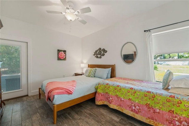 2013 Tule Park Dr, Rockport, TX 78382 - bedroom with multiple windows, wood finished floors, and a ceiling fan