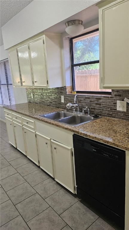 4433 Aspen Grove Dr, Corpus Christi, TX 78413 - kitchen featuring black dishwasher, light tile patterned floors, decorative backsplash, white cabinets, and a textured ceiling