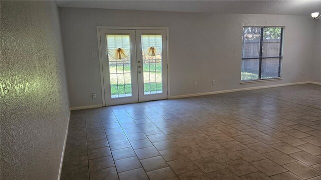 4433 Aspen Grove Dr, Corpus Christi, TX 78413 - unfurnished room featuring french doors and tile patterned flooring