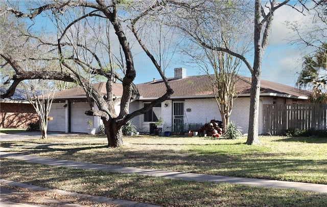 single story home featuring a front yard, fence, a chimney, a garage, and brick siding