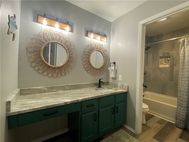 full bathroom with toilet, vanity, shower / bath combination with curtain, and hardwood / wood-style floors