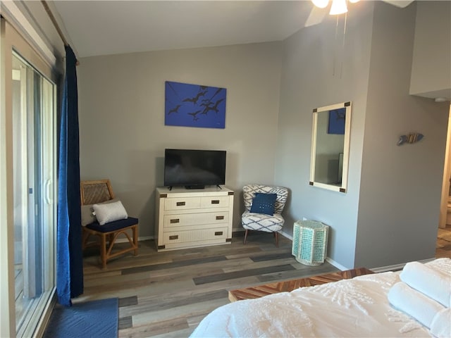 bedroom featuring lofted ceiling and dark hardwood / wood-style floors